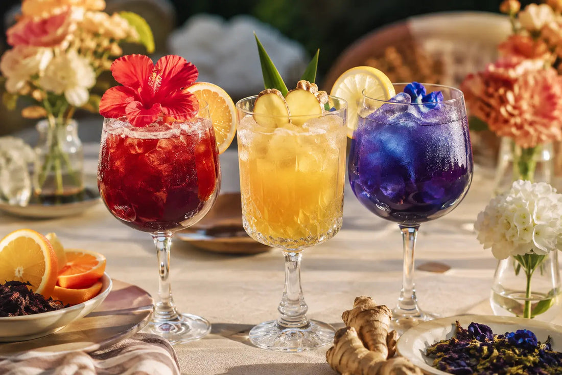 Three colourful sparkling herbal tea mocktails