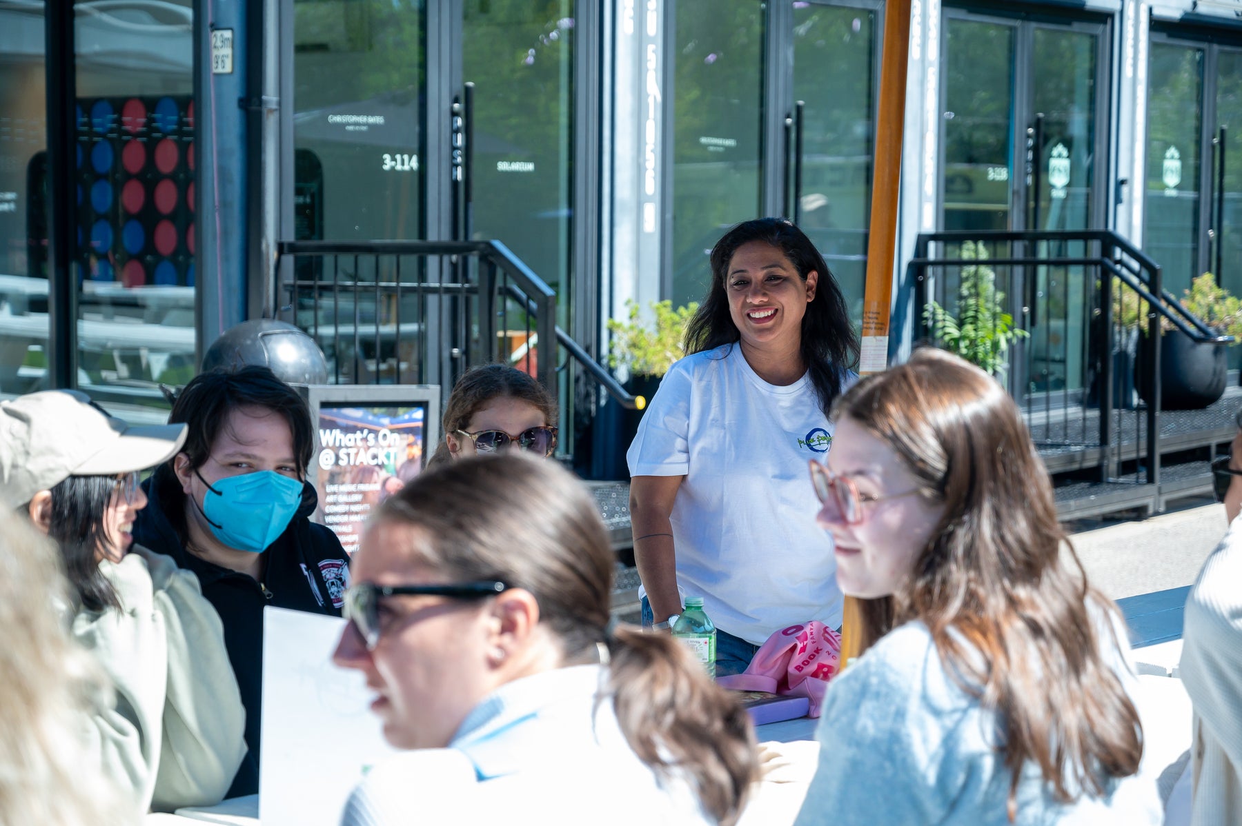 Blue Pepper founder Trupti Sedani Pandhi sharing tea at an outdoor community event
