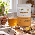 Ginger Kick pouch beside a steaming hot infusion in a natural home setting