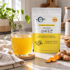 Turmeric Twister pouch beside a steaming hot infusion in a natural home setting